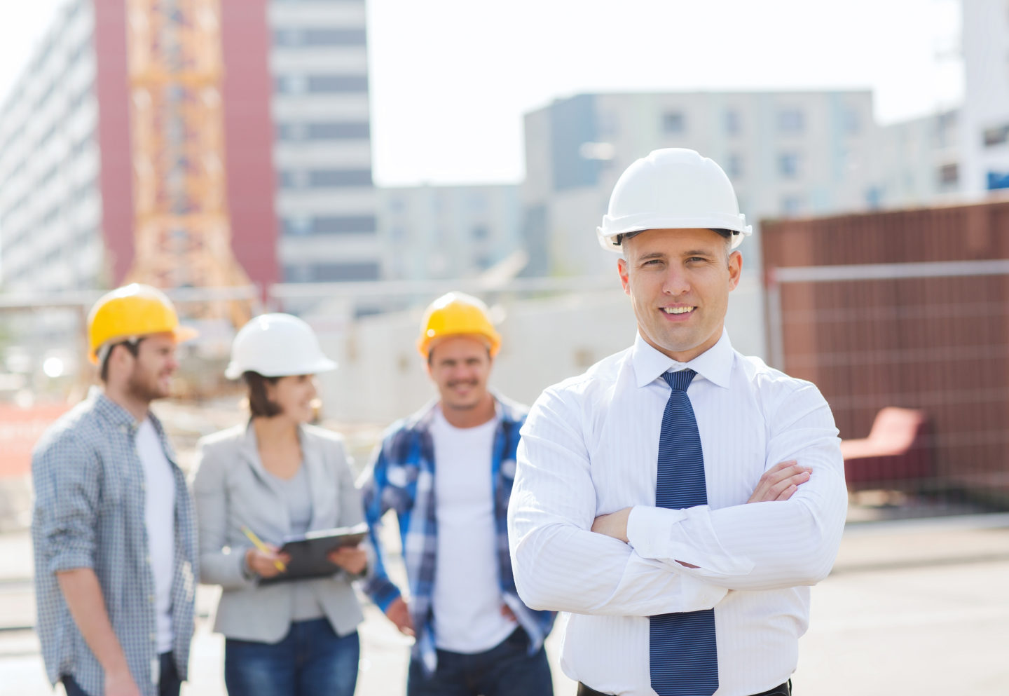 General Contractor Business Owner with Team on Site