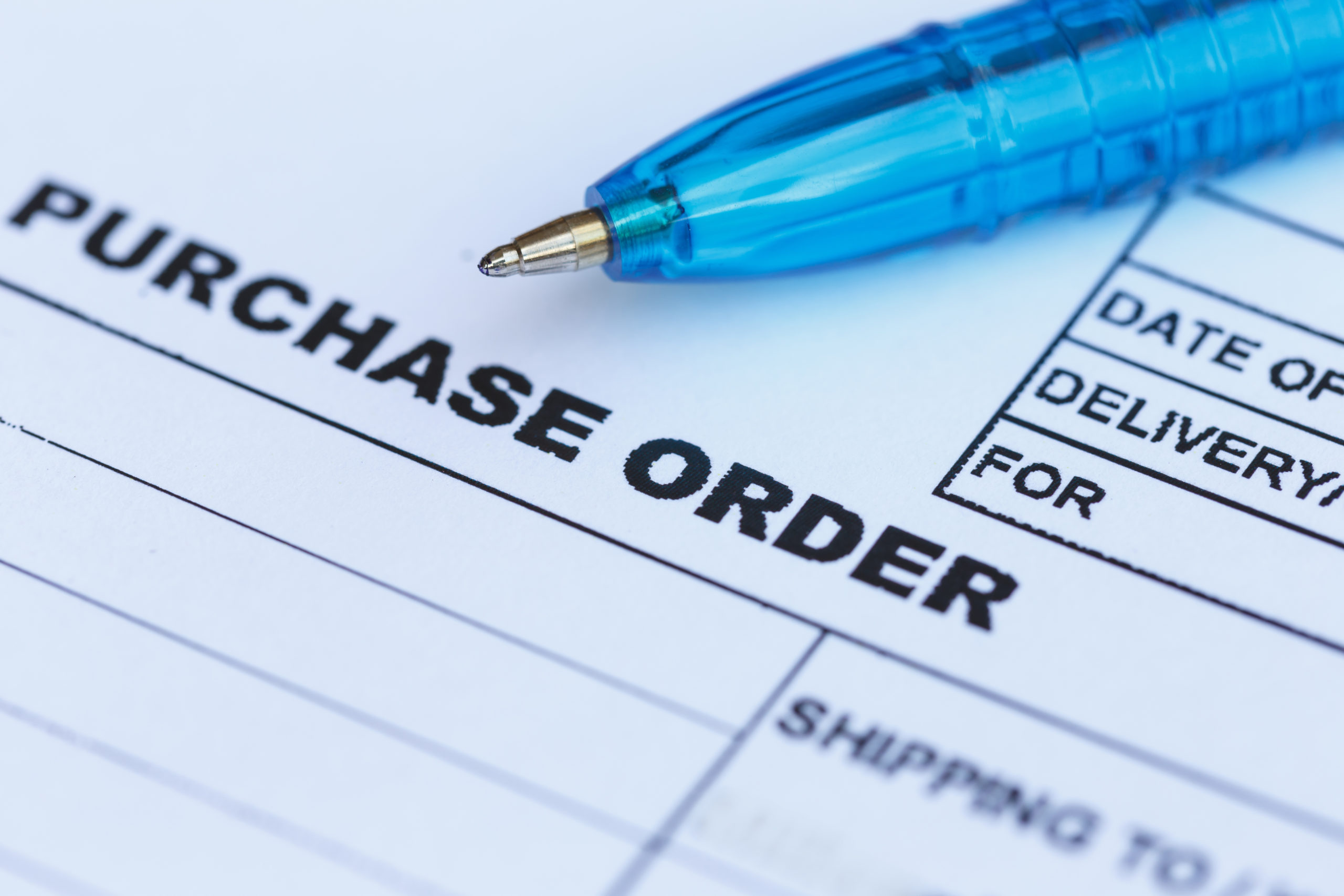 purchase order with blue pen in the office purchase order with blue pen in the office